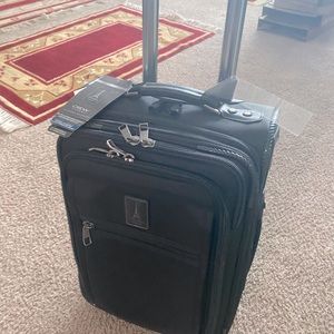 Travelpro 20” carry-on, new with tags, $180